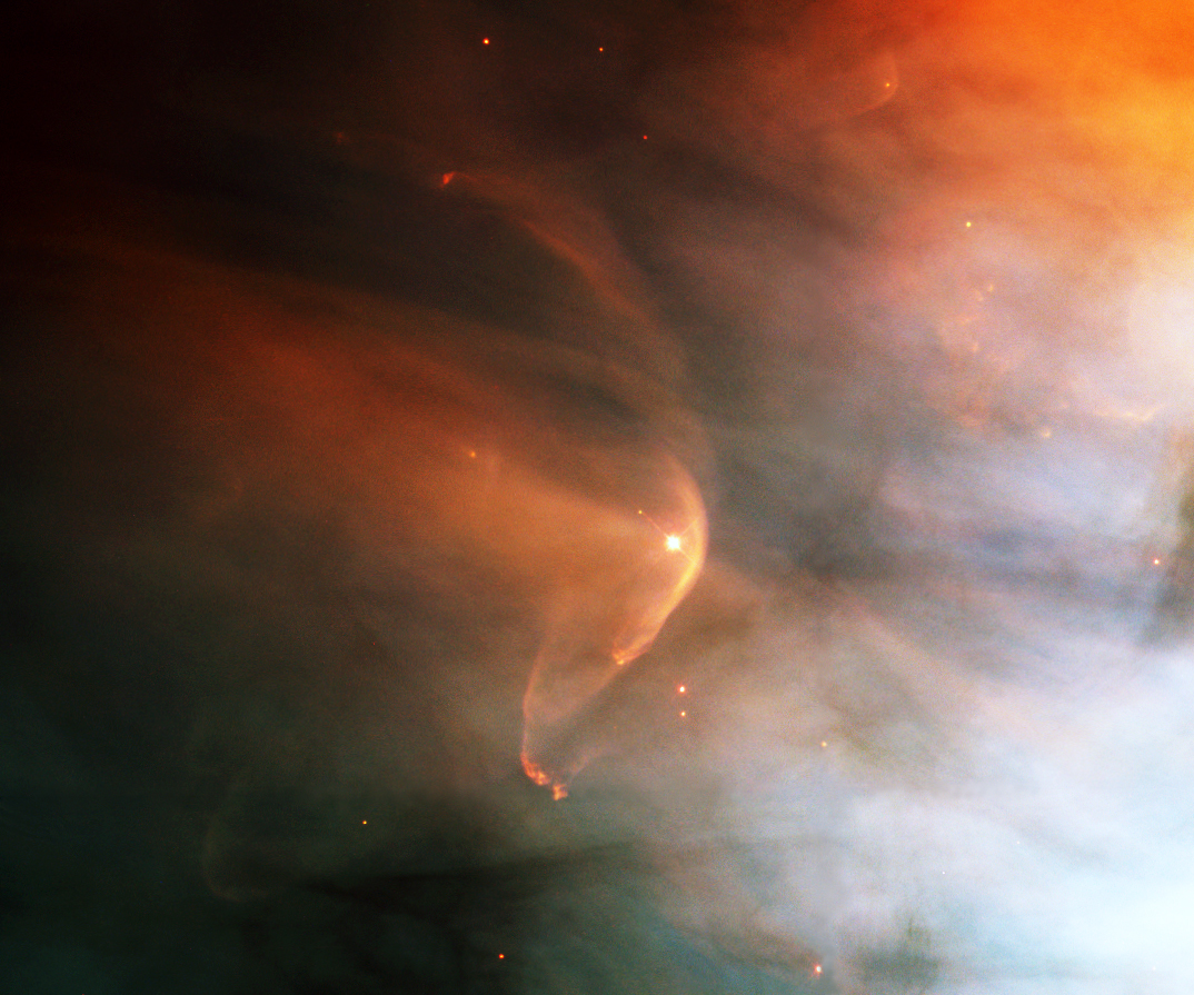 Bow shocks form whenever a flow travels faster than the speed of sound, whether in air, water, or even plasma. In this case, we see the striking LL Orionis bow shock in the Orion Nebula. Here, the powerful stellar wind from LL Orionis collides head on with the slower moving nebular gas, creating a curved shock front. This dramatic interaction was captured by the Hubble Space Telescope in 1995, revealing the beauty of astrophysical shock waves on a cosmic scale.